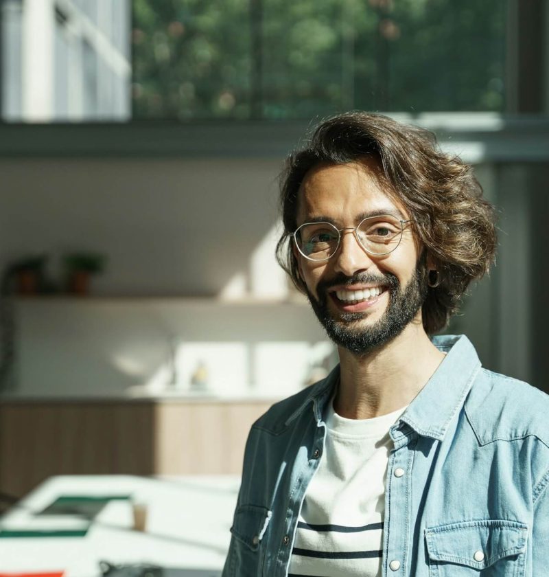 young-man-with-beard-and-eyeglasses-employee-worker-of-a-tech-creative-startup-company.jpg